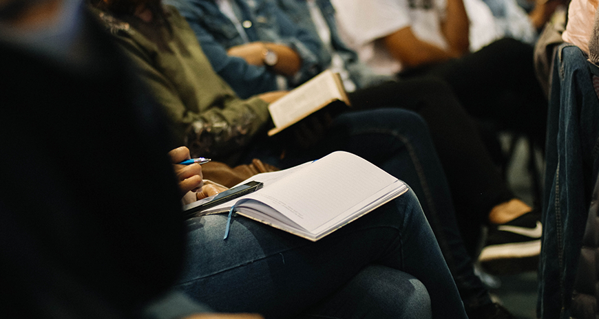 People sitting in auditorium for conference